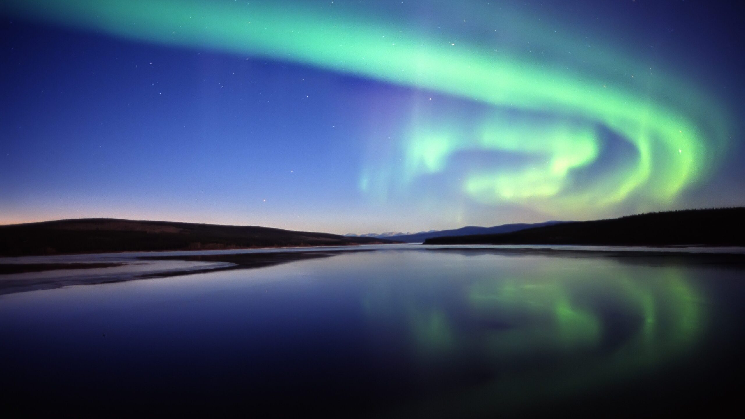 Aurora/Northern Lights over a frozen lake, Yukon Territory.